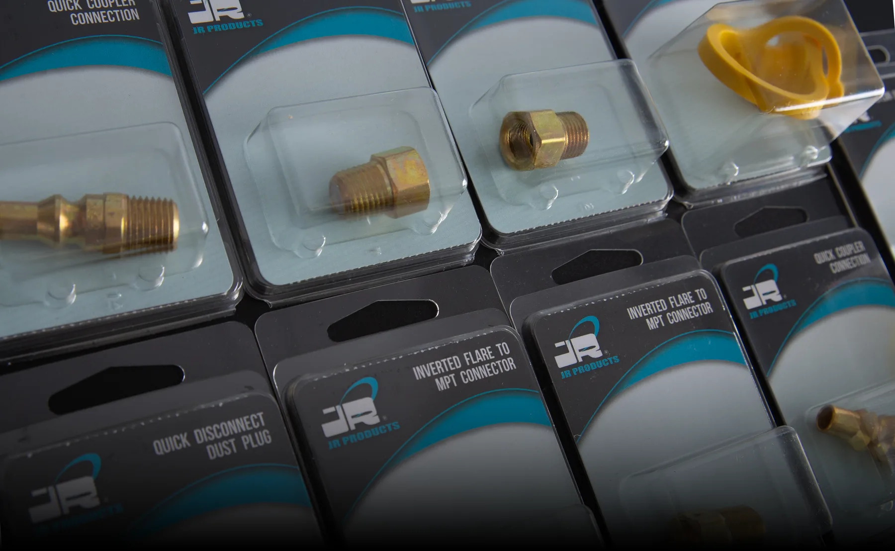 JR Products packaged LP gas fittings and accessories displayed as a retail assortment